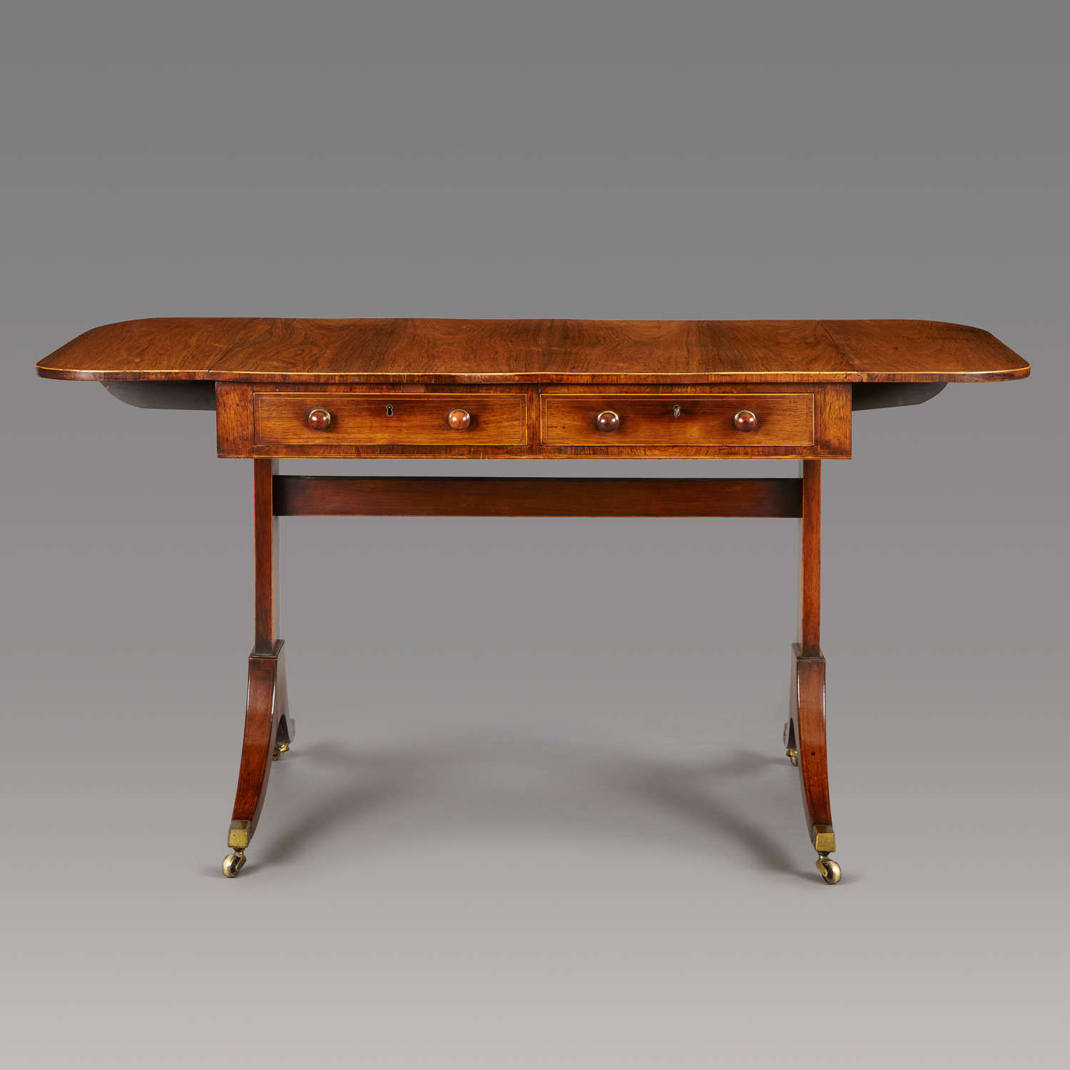 A late 18th Century rosewood end-support sofa  table