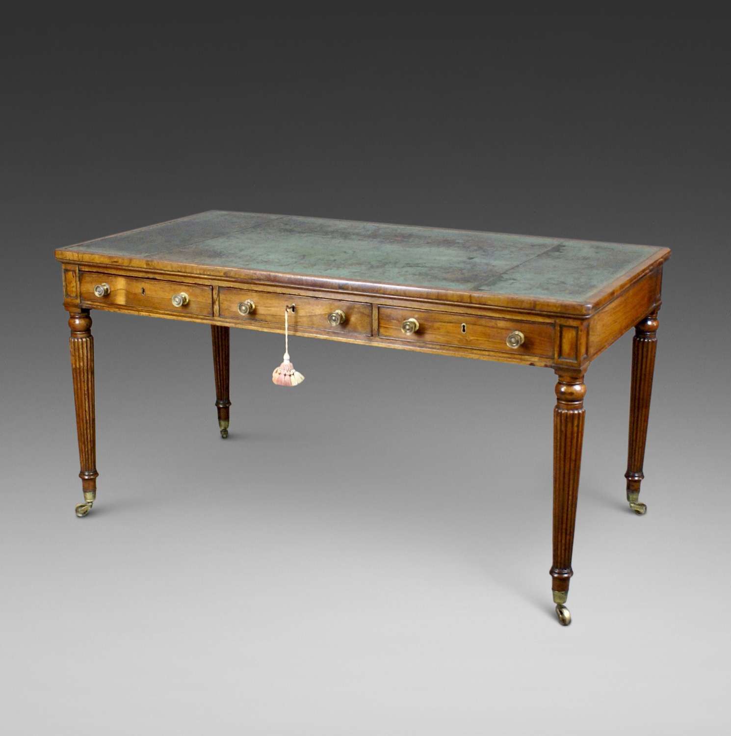 A  fine late George III period rosewood writing/library table