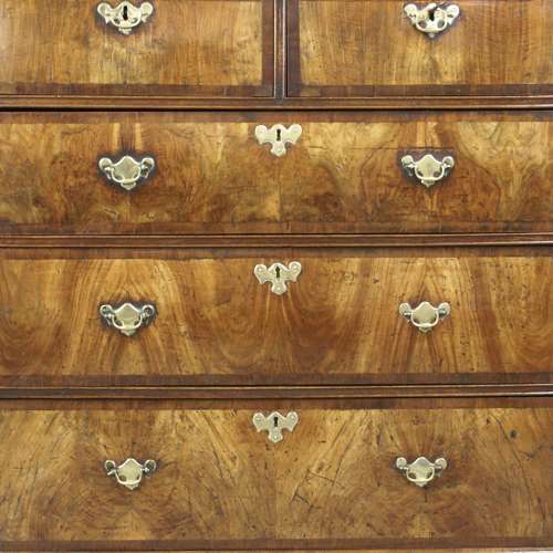 An early 18th Century walnut five drawer chest
