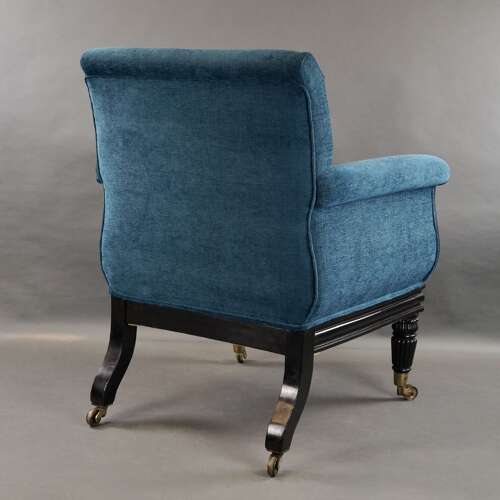 A later Regency period ebonised armchair
