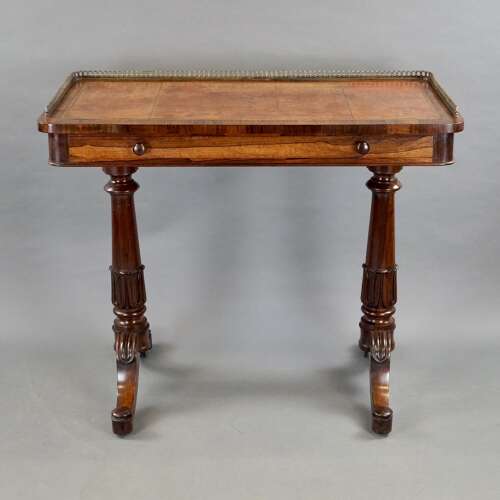 A mid- 19th century rosewood writing table