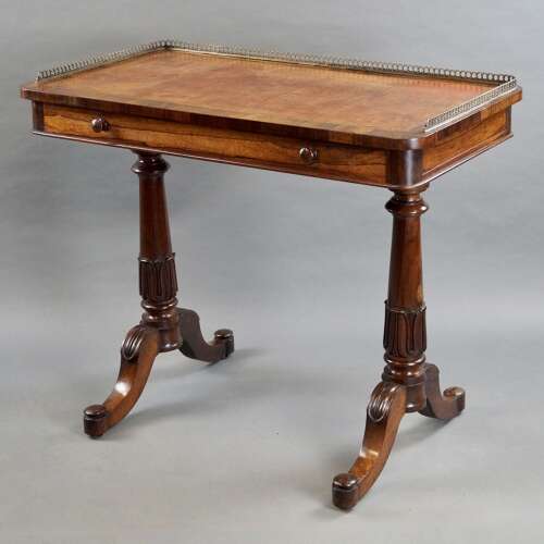 A mid- 19th century rosewood writing table