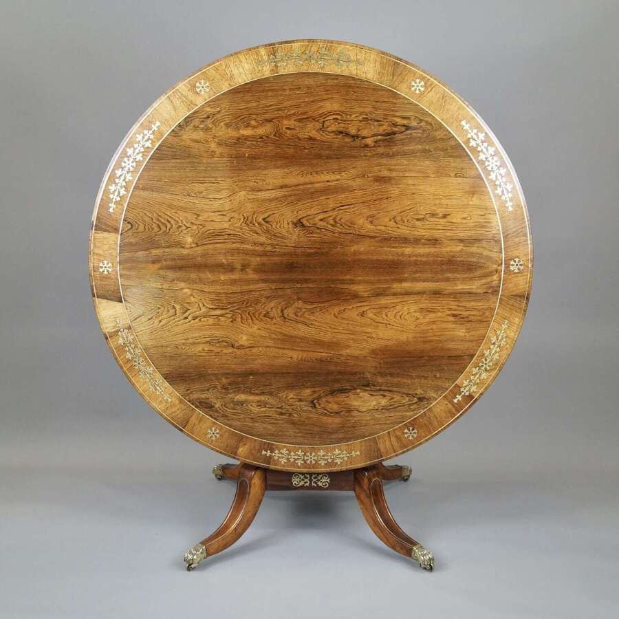 A Regency period rosewood and brass inlaid breakfast table