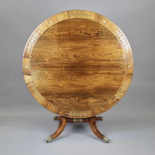 A Regency period rosewood and brass inlaid breakfast table