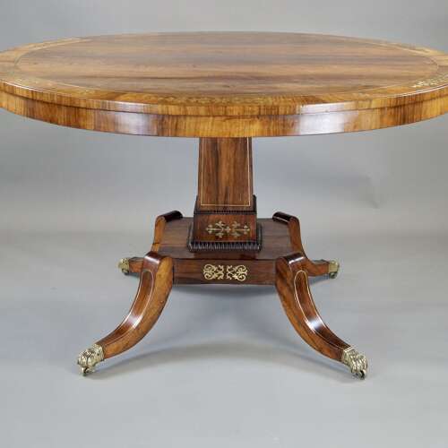 A Regency period rosewood and brass inlaid breakfast table