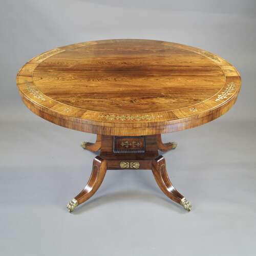 A Regency period rosewood and brass inlaid breakfast table