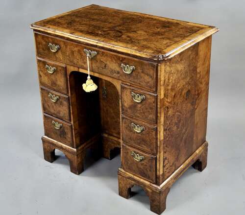 A rare burr oak knee-hole desk